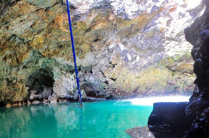 Blue Hole Mineral Spring and Rick's Cafe - Rick’s Cafe and the west-end cliff views