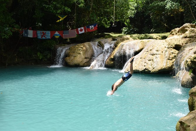 Blue Hole & Secret Falls Day Trip plus Shopping from Runaway Bay - Entering Cool Blue Hole for rope swings and rock jumps