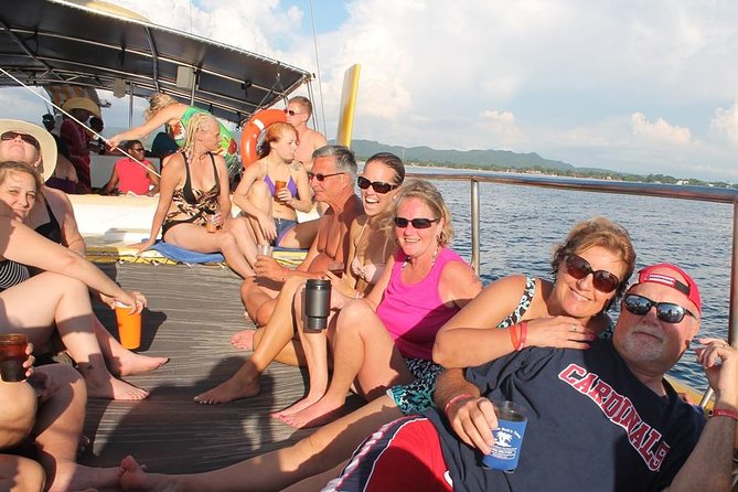 Catamaran Cruise Full Day Tour to Reef, Caves and Negril Beach - Boarding the catamaran means wading into the water
