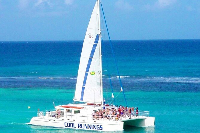 Catamaran Party Cruise and Snorkeling from Montego Bay - DJ music, Jamaican snacks, and the open bar