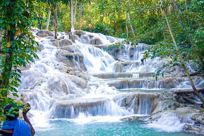 Dunn's River Falls, River Tubing, and Horseback Riding With Transportation - Climbing Dunn’s River Falls at 180 feet