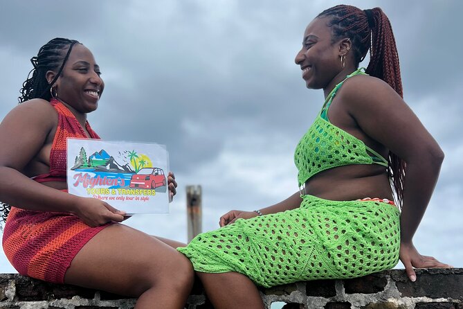 Explore Negril Day Tour beach and Ricks Cafe From Montego Bay - The Negril sign, quick photos, and the road west