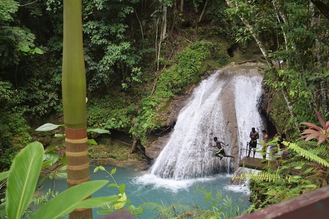 "Explore Scenic Tropical Waterfalls at Blue Hole" - A cave, spring water, and Jamaican clay