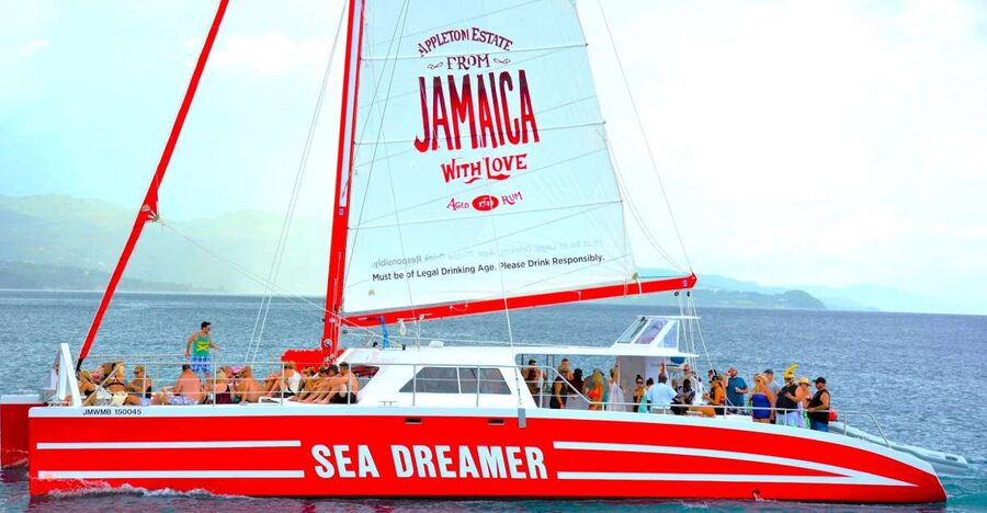 Montego Bay Catamaran Cruise and Snorkeling Tour - Sailing the Montego Bay coastline by catamaran