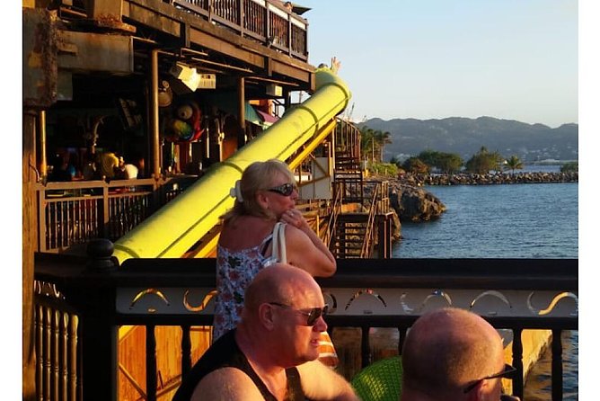 Montego Bay’s Sightseeing Tour with Options to Customize - Eating beef patties, jerk chicken, and local favorites
