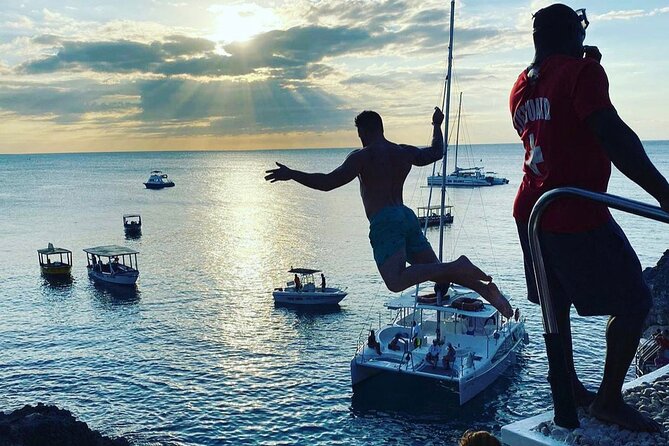 Negril 7 mile Beach, Party Catamaran Cruise , Snorkeling and Ricks Cafe Combo - Rick’s Cafe brings the day to a dramatic close