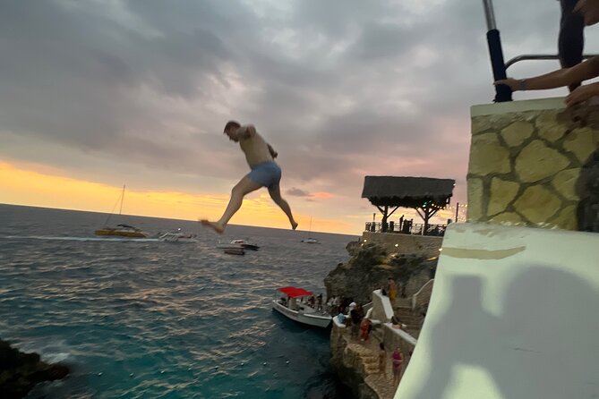 Negril Private Day Tour: ATV Ride, Party Catamaran & Ricks Cafe - Rick’s Cafe for cliff jumping and sunset