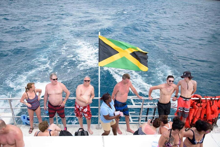 Ocho Rios Catamaran: Dunn's River, Snorkeling & Open Bar - Climbing Dunn’s River Falls With a Local Guide