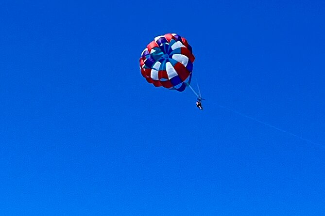 Parasailing above Turquoise Ocean Waters in Montego Bay - The View Is the Main Event