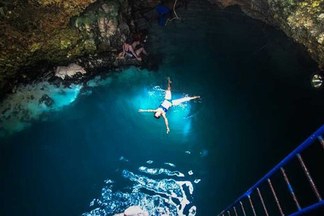 Parasailing, Blue Hole Mineral Spring, Seven Mile Beach - A beach day with one good jolt of adventure