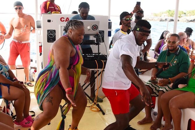 Party Catamaran: OpenBar, Music, Negril Beach, Caves, Snorkeling - Rick’s Cafe, cliff-jumping, and sunset timing