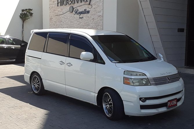 Private Airport Transfer Montego Bay and Negril - Red Stripe, water, and a Jamaican soft drink